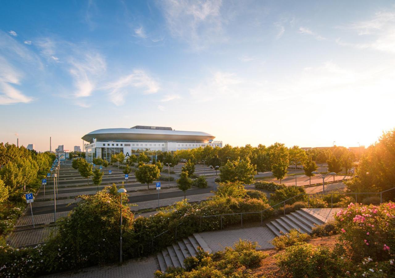 Hostel MHG Exterior photo The stadium at sunset