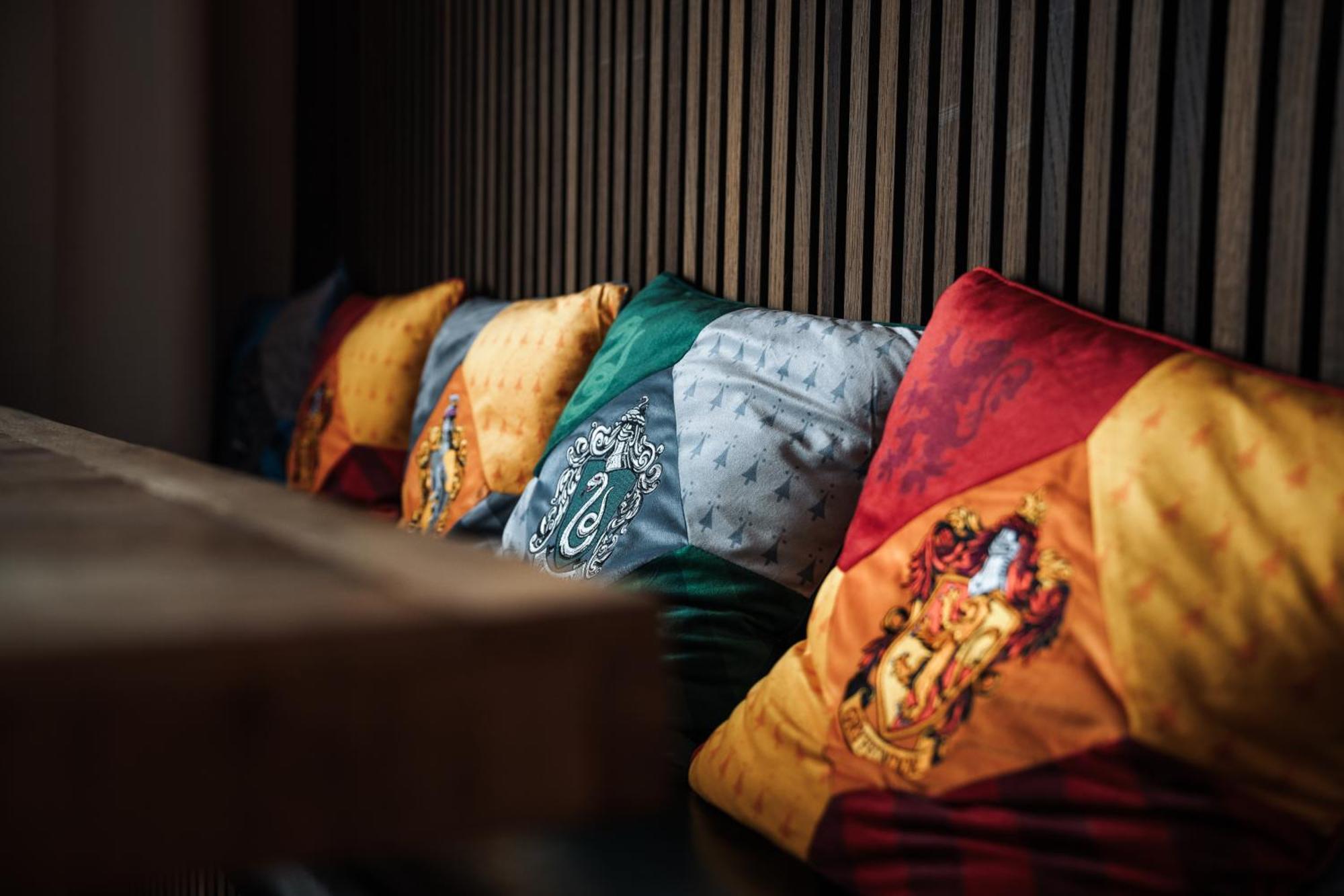 Hostel MHG Exterior photo Pillows with the coats of arms of the four houses