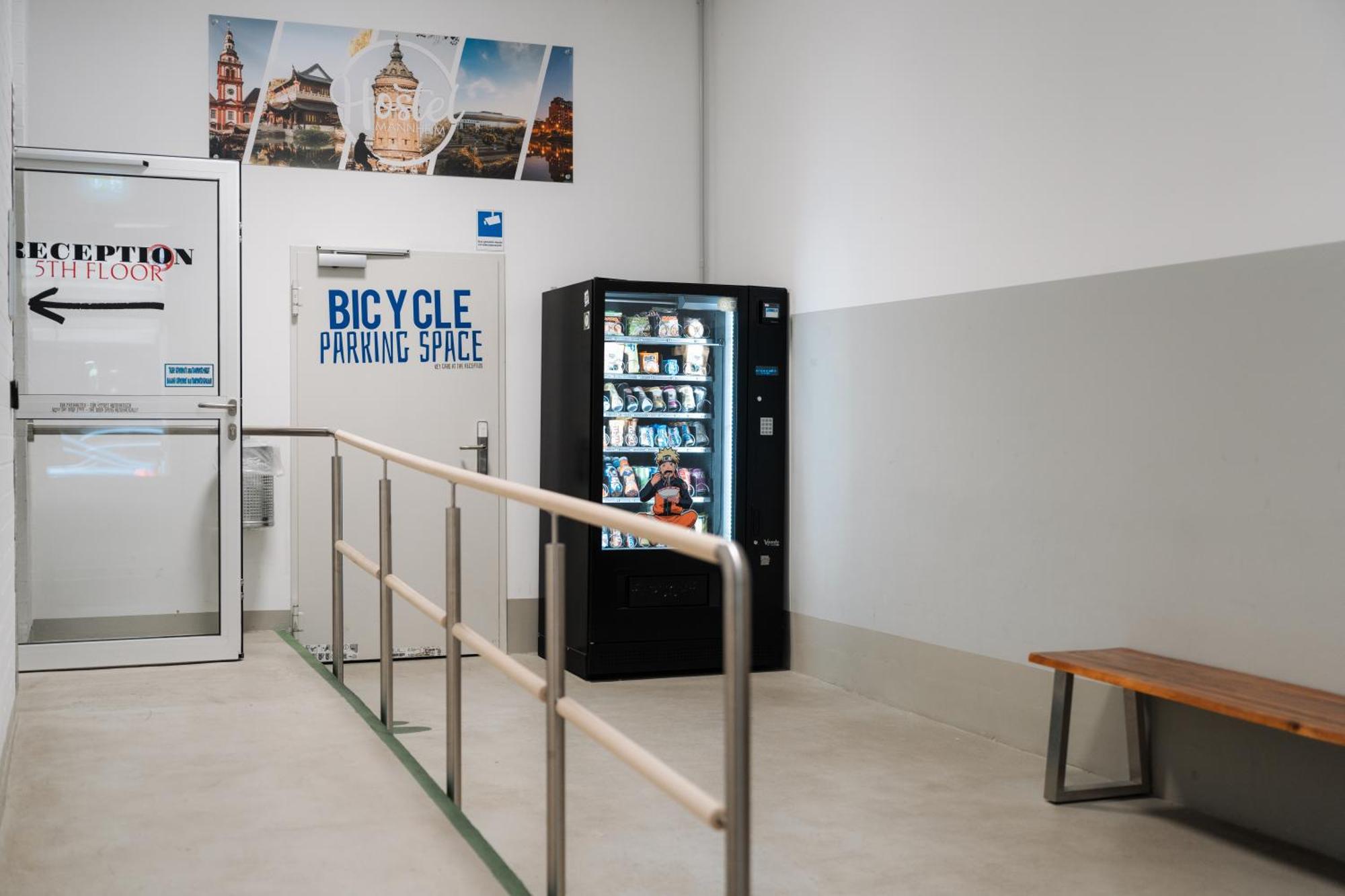 Hostel MHG Exterior photo A vending machine in a bicycle parking garage